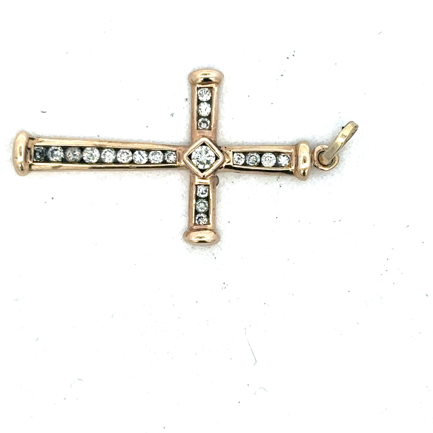 9ct yellow gold diamond cross pendant with intricate design, crafted by Reeves and Sons, displayed against a neutral background.