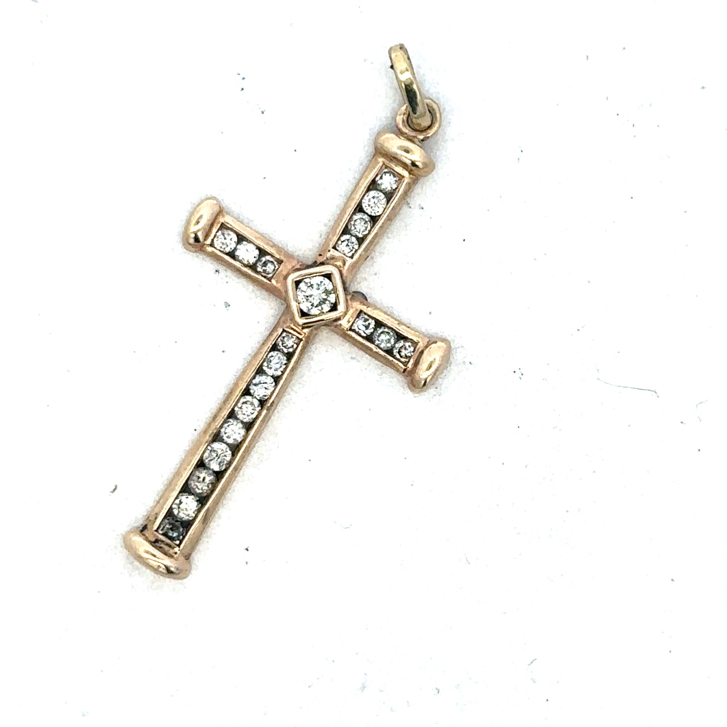 9ct yellow gold diamond cross pendant from Reeves and Sons, showcasing a detailed gold pendant with sparkling diamonds.