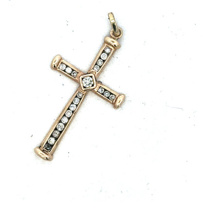 9ct yellow gold diamond cross pendant from Reeves and Sons, showcasing a detailed gold pendant with sparkling diamonds.