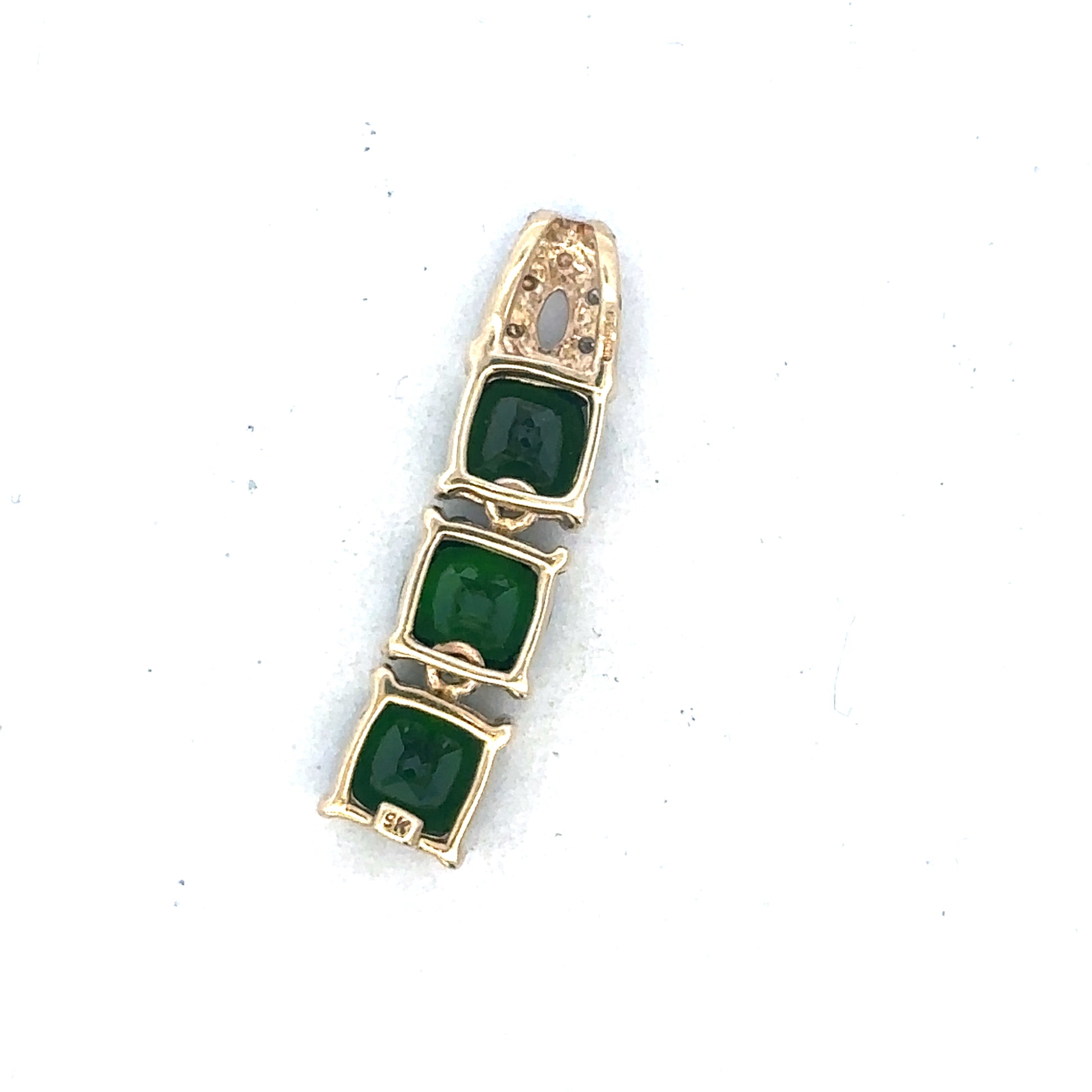 9ct yellow gold diamond pendant by Reeves and Sons, showcasing a delicate gold chain with a sparkling diamond pendant.