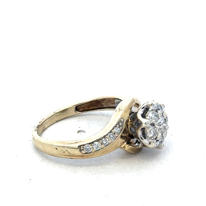 9ct yellow gold diamond ring by Reeves and Sons, featuring a elegant design with sparkling diamonds and a polished finish.