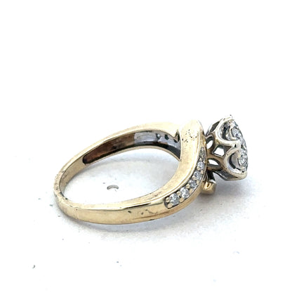 9ct yellow gold diamond ring by Reeves and Sons featuring sparkling diamonds and a classic design.