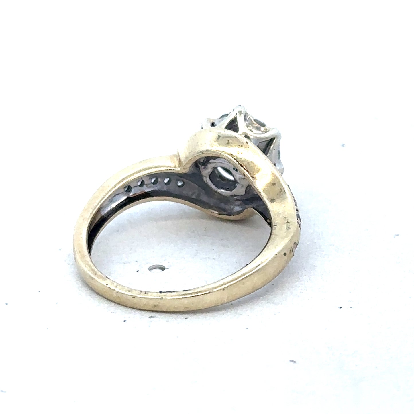 9ct yellow gold diamond ring by Reeves and Sons featuring a sparkling diamond centerpiece and elegant band design.