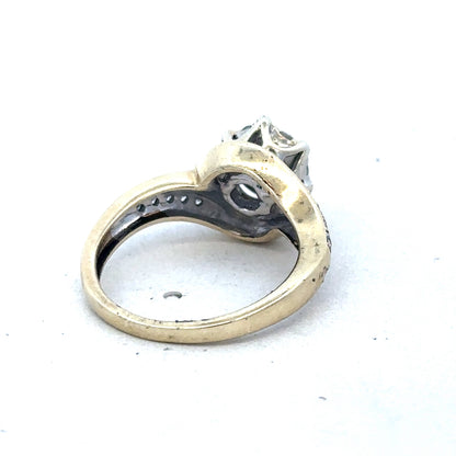 9ct yellow gold diamond ring by Reeves and Sons featuring a sparkling diamond centerpiece and elegant band design.