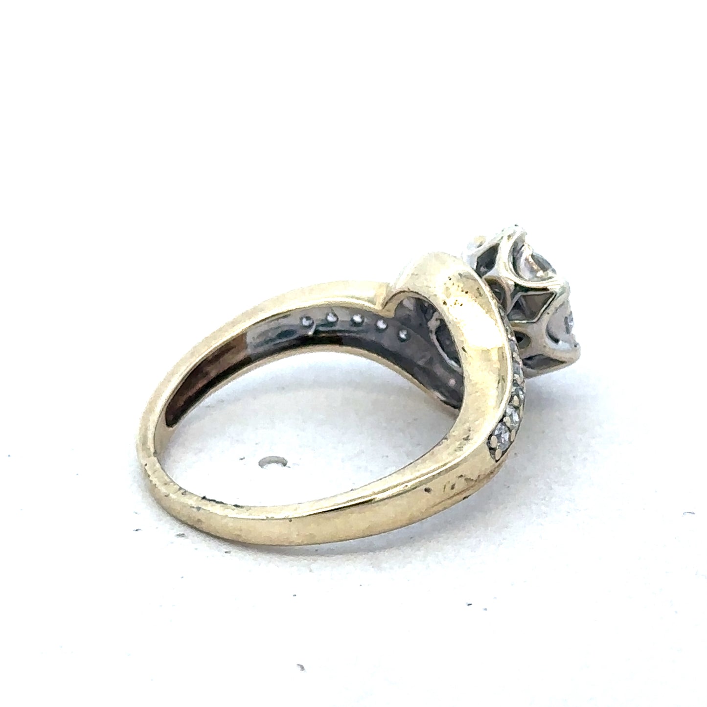 9ct yellow gold diamond ring by Reeves and Sons, featuring a sparkling diamond design, showcased in a close-up image.