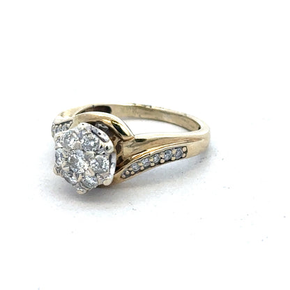 9ct yellow gold diamond ring by Reeves and Sons featuring a sparkling central diamond and elegant design.