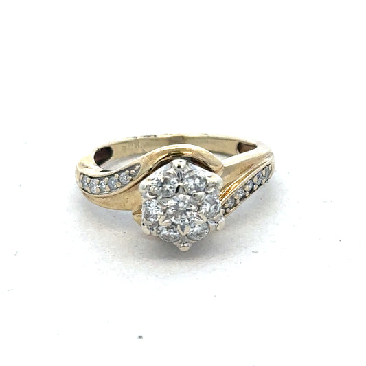 9ct yellow gold diamond ring by Reeves and Sons with sparkling diamonds and a classic band design.
