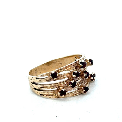 Elegant 9ct yellow gold ring by Reeves and Sons, showcasing a smooth polished band with classic design.