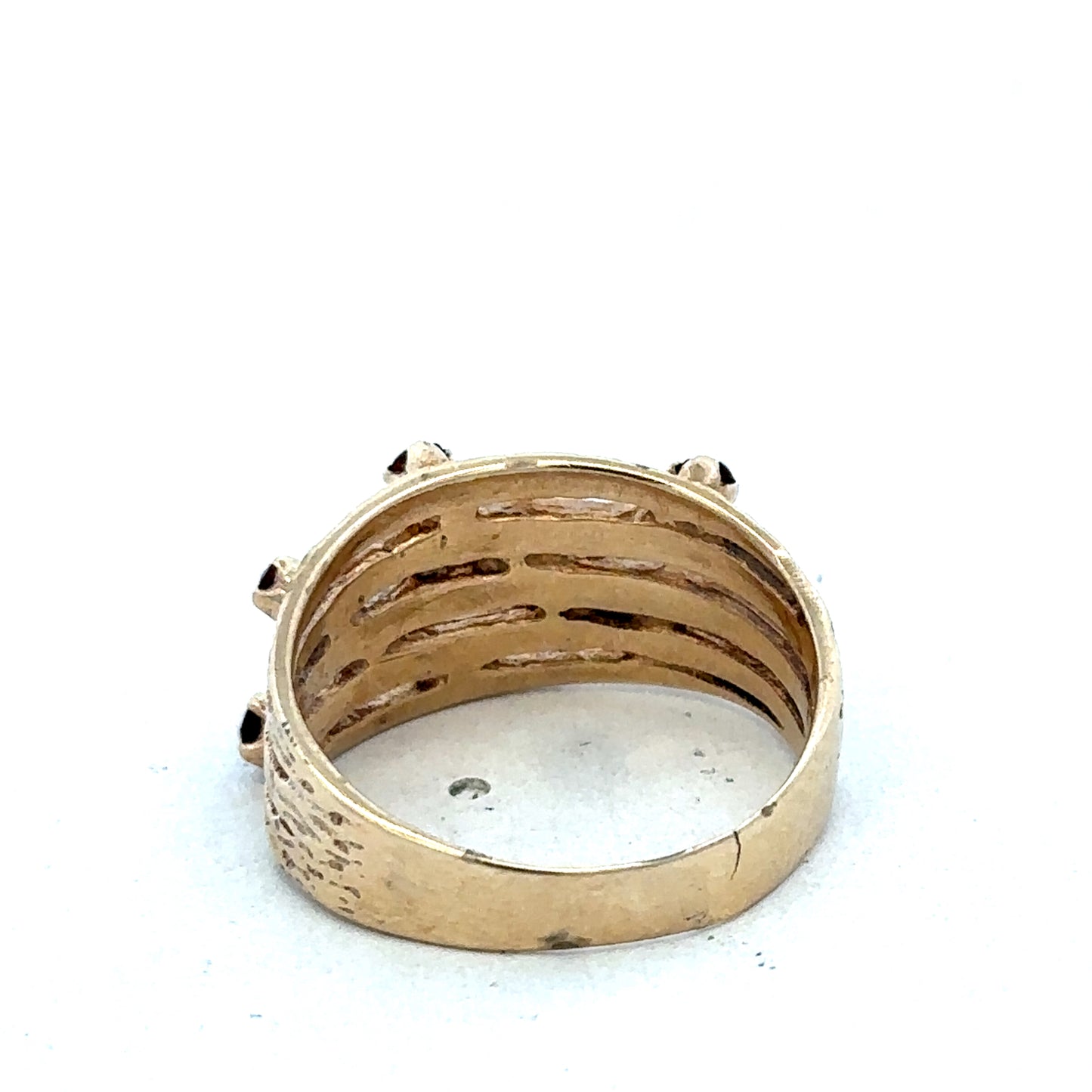 9ct yellow gold ring featuring a smooth band, crafted by Reeves and Sons, shown in close-up detail.