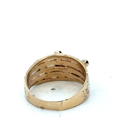 Close-up of 9ct yellow gold ring with smooth polished band, featuring subtle engraved detailing, from Reeves and Sons.