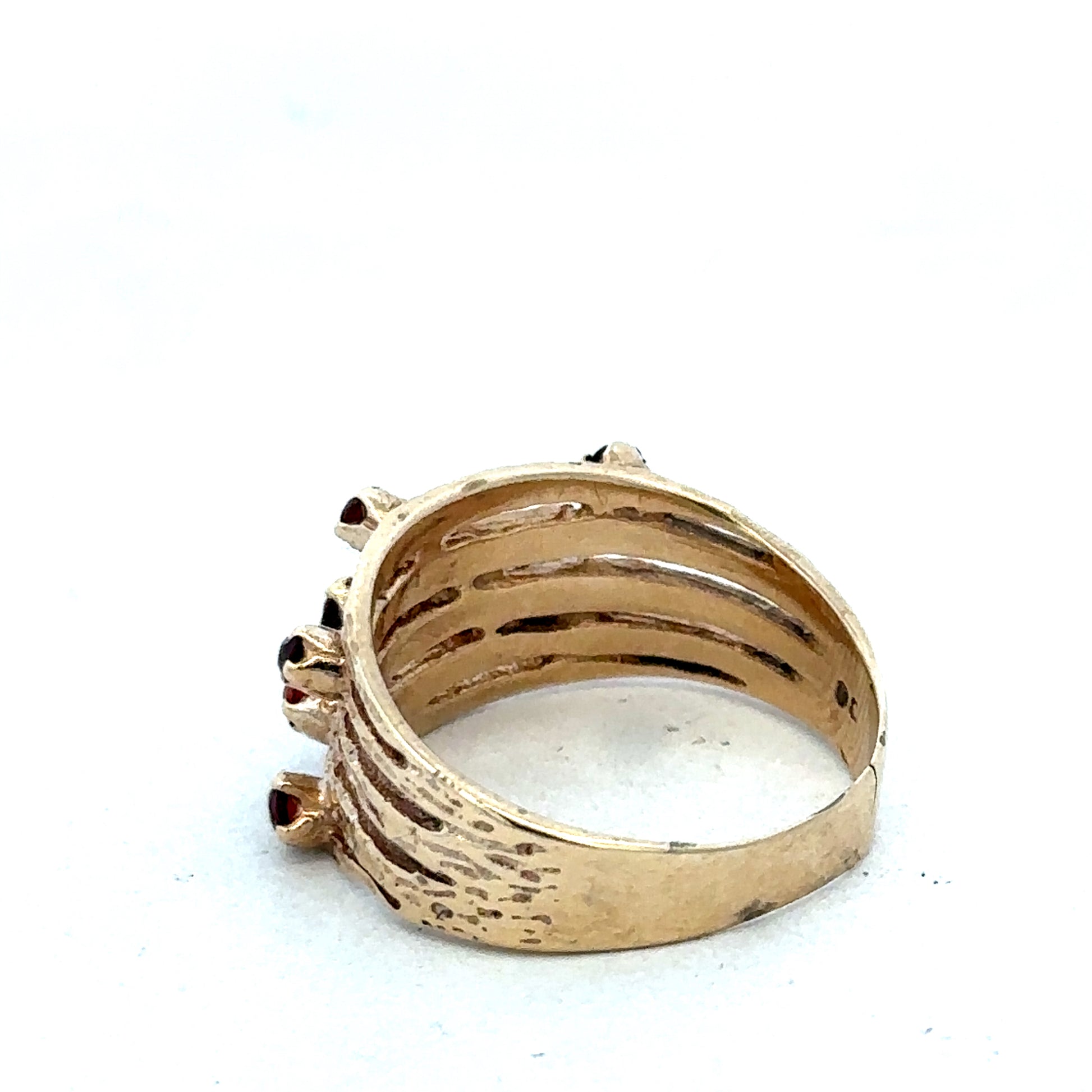 Elegant 9ct yellow gold ring by Reeves and Sons featuring a smooth polished band on a plain background.