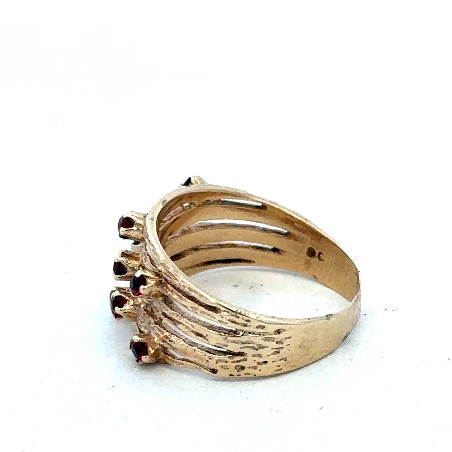 Yellow gold ring by Reeves and Sons, 9 carat, with a simple smooth band design.