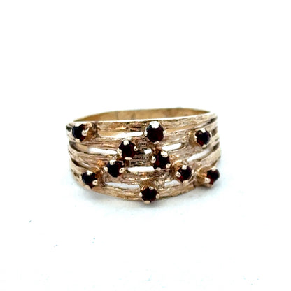 9ct yellow gold ring with smooth band, crafted by Reeves and Sons, shown in a close-up image.