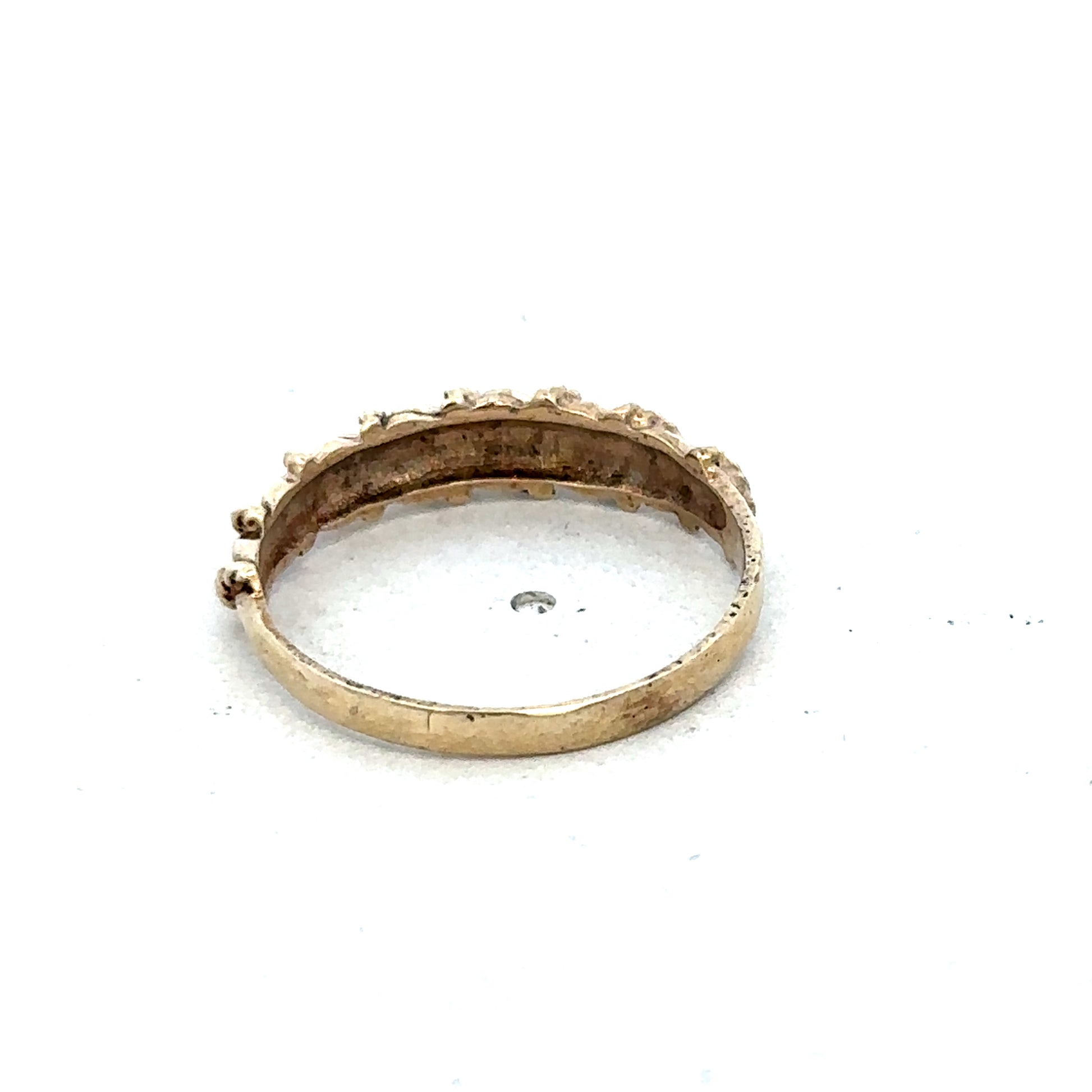 9ct yellow gold ring size K from Reeves and Sons, close-up showing smooth band and polished finish.
