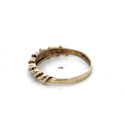 9ct yellow gold ring size K by Reeves and Sons, close-up image showing smooth band and polished finish.