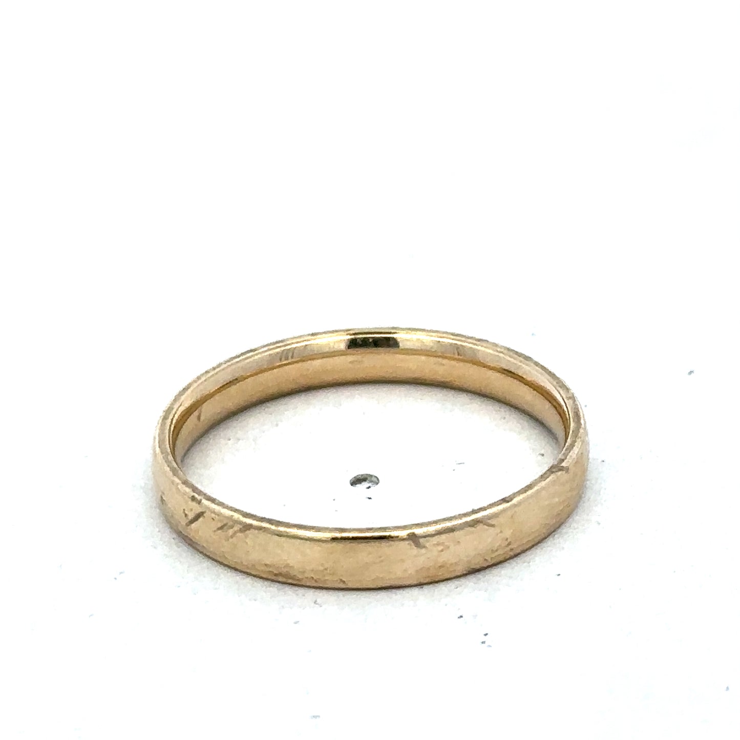 9ct yellow gold ring size T from Reeves and Sons with a smooth polished band and subtle gold sheen.