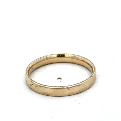 9ct yellow gold ring size T from Reeves and Sons with a smooth polished band and subtle gold sheen.