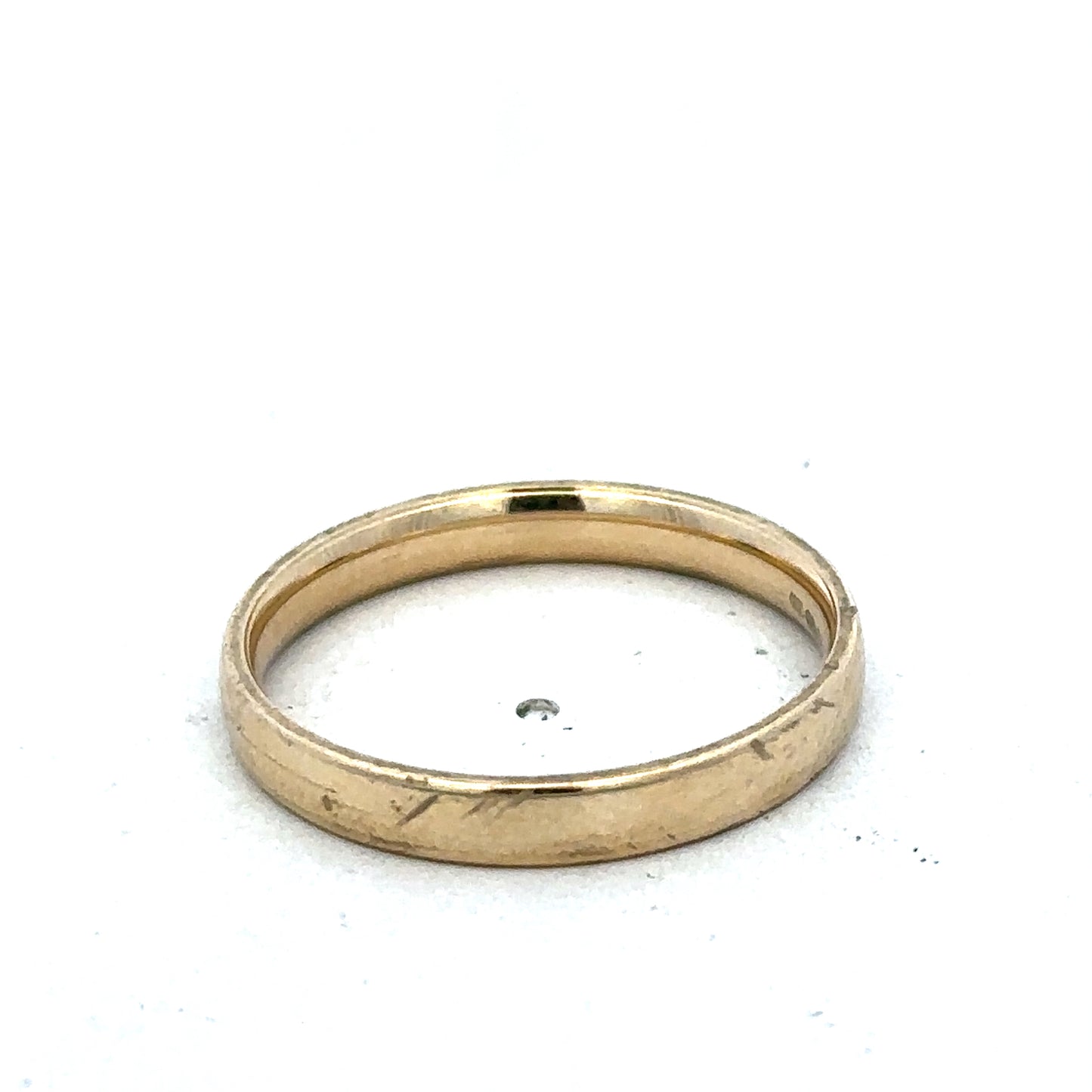9ct yellow gold ring size T by Reeves and Sons, showcasing a polished band with a smooth finish.