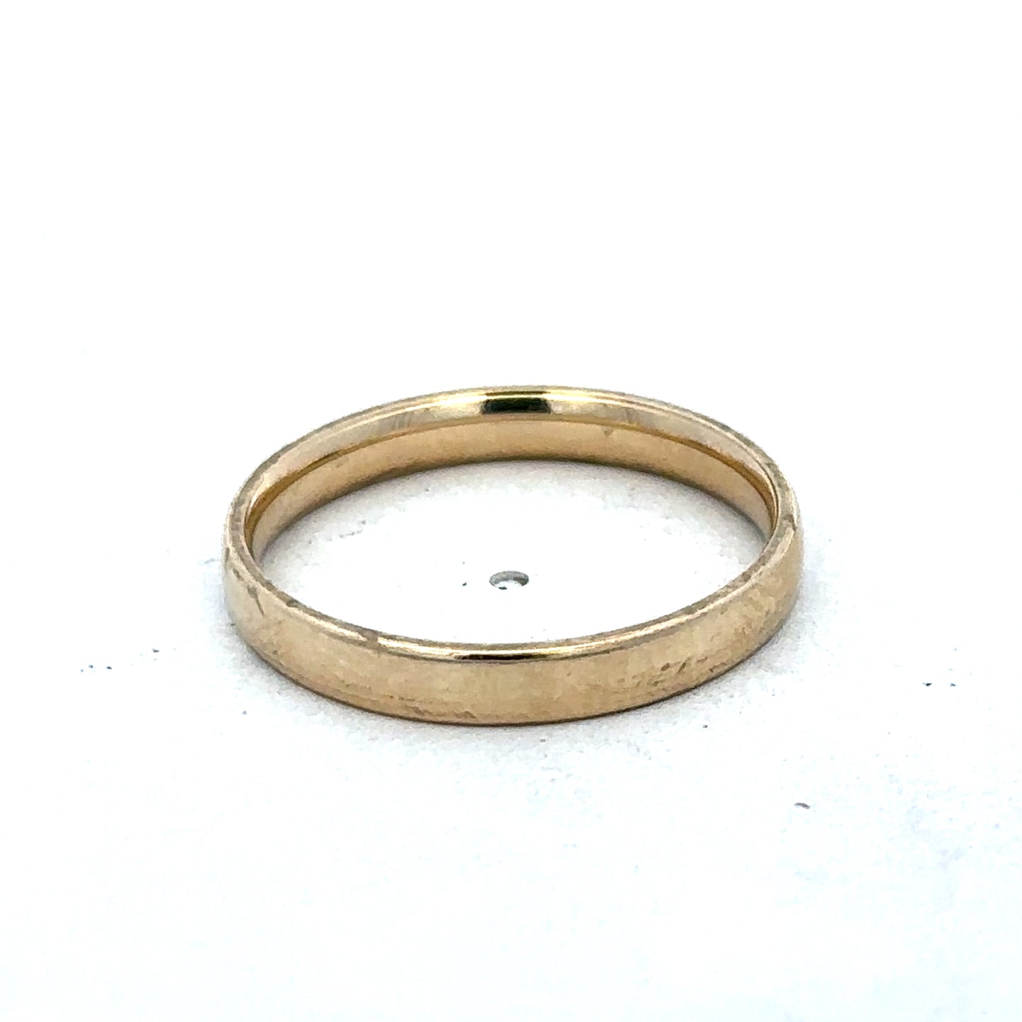 9ct yellow gold ring size T from Reeves and Sons, showcasing a polished band with a smooth finish.
