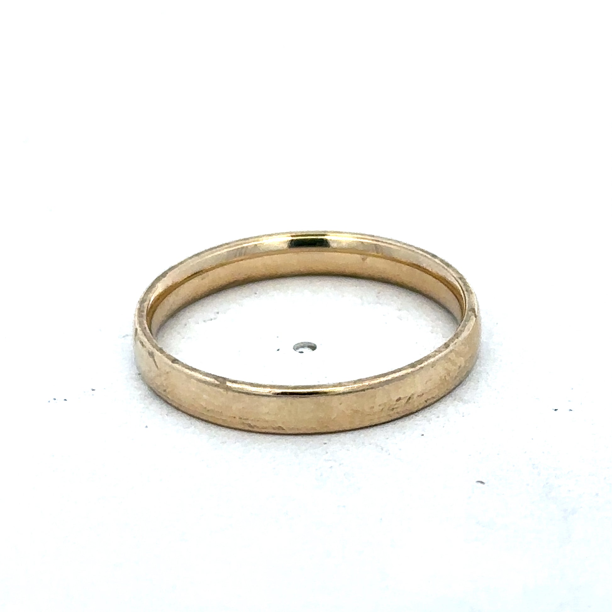 9ct yellow gold ring size T from Reeves and Sons, showcasing a polished band with a smooth finish.