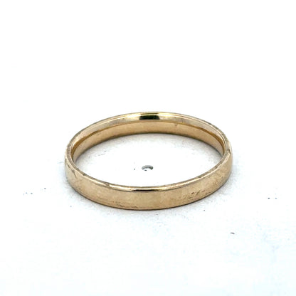 9ct yellow gold ring size T from Reeves and Sons, showcasing a polished band with a smooth finish.