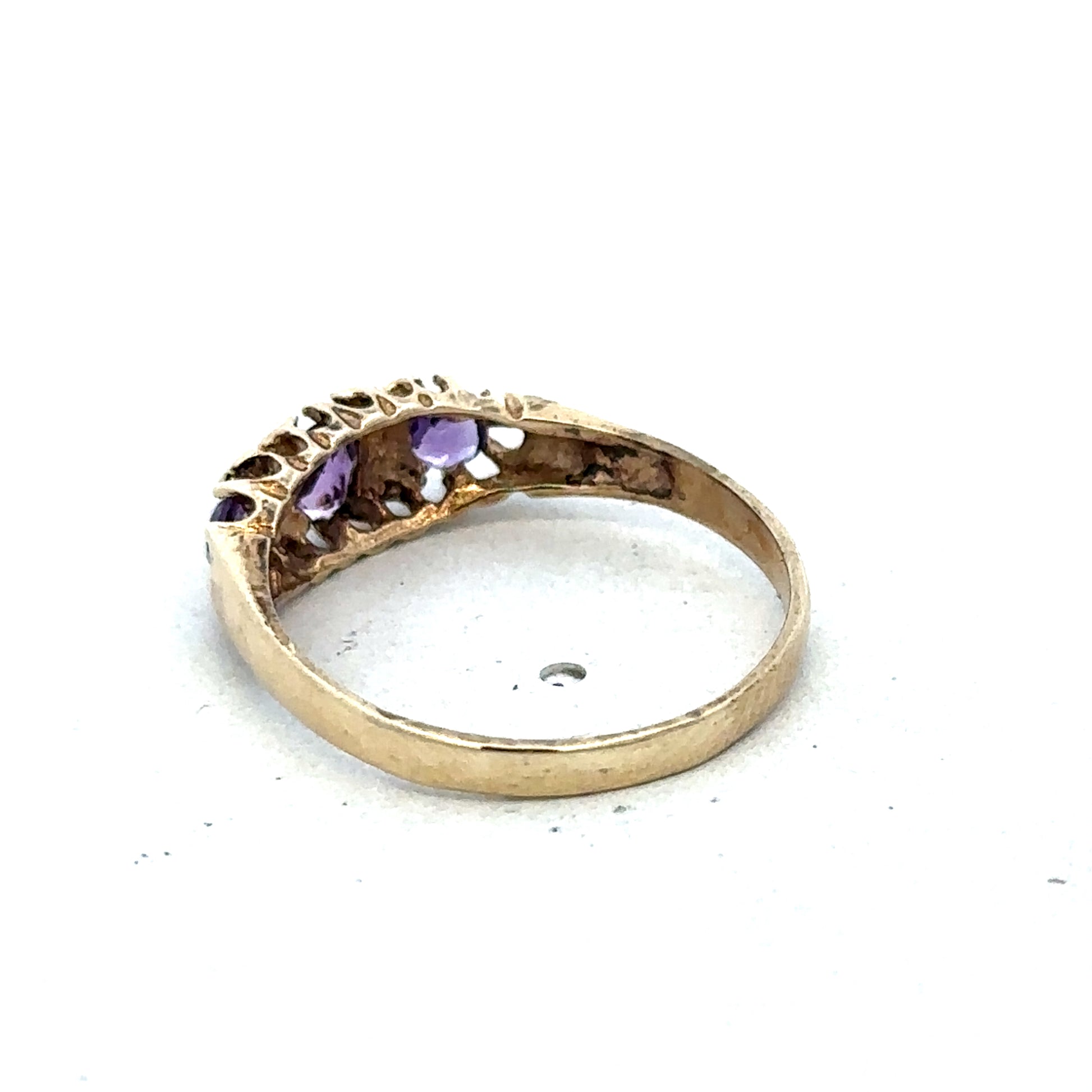 9ct yellow gold ring in size N with a smooth band, crafted by Reeves and Sons, shown on a plain background.