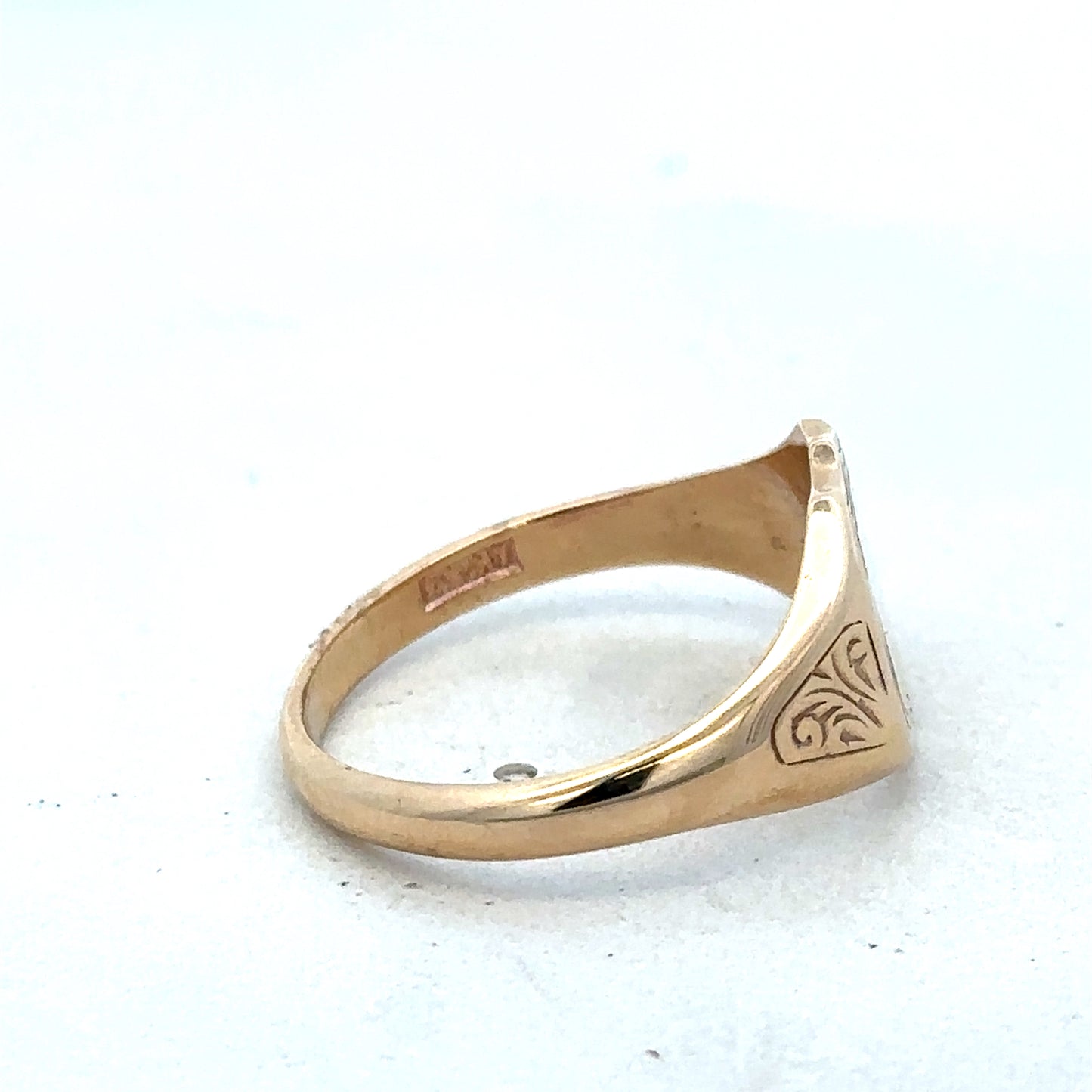 9ct yellow gold signet ring in size T with Reeves and Sons branding, showcasing a polished, classic design with smooth finish.