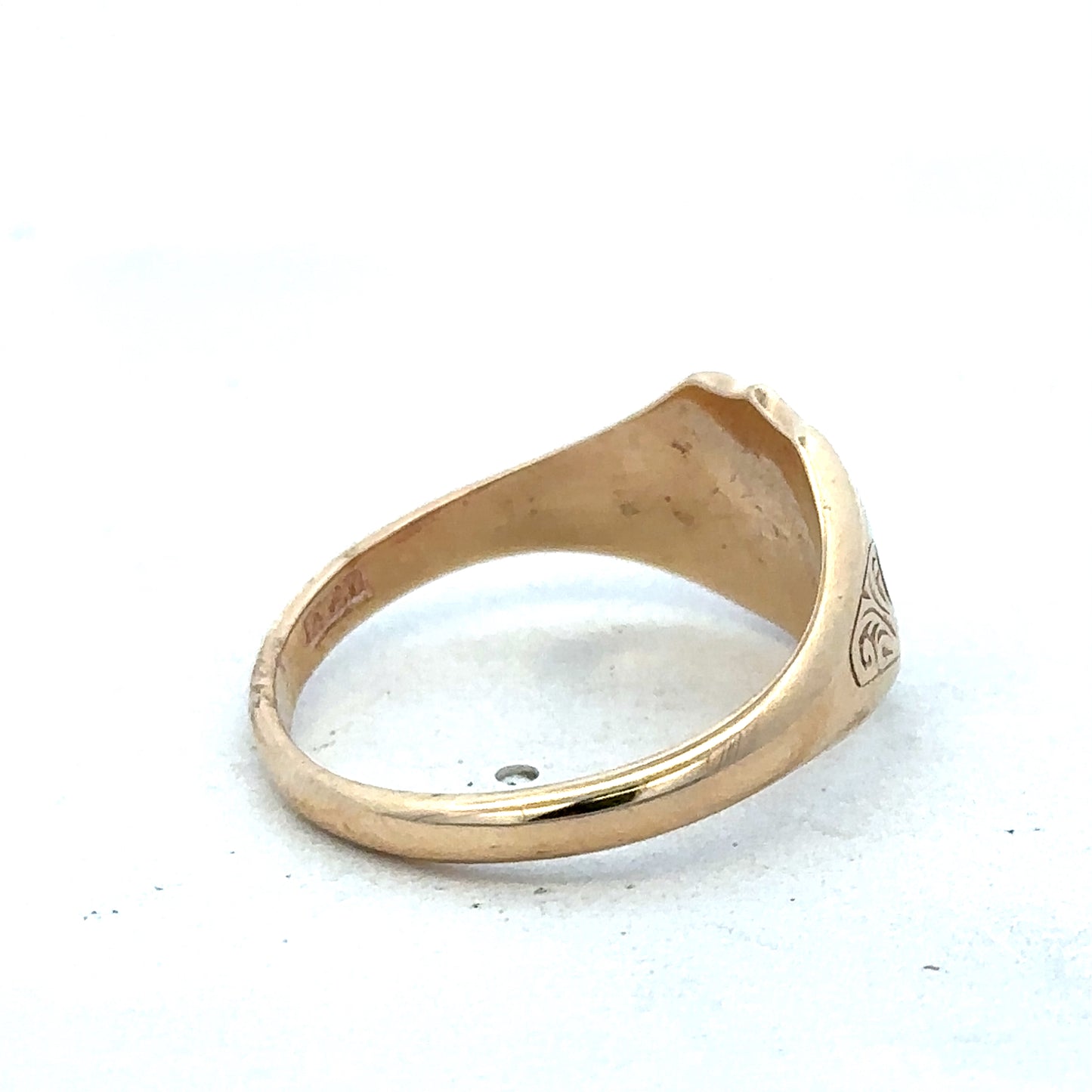 9ct yellow gold signet ring in size T with Reeves and Sons branding, featuring a polished, classic design.