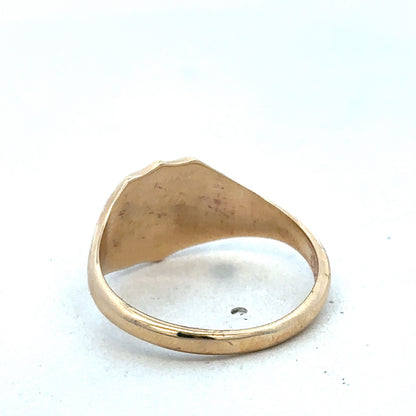 9ct yellow gold signet ring in size T with smooth polished surface, crafted by Reeves and Sons.