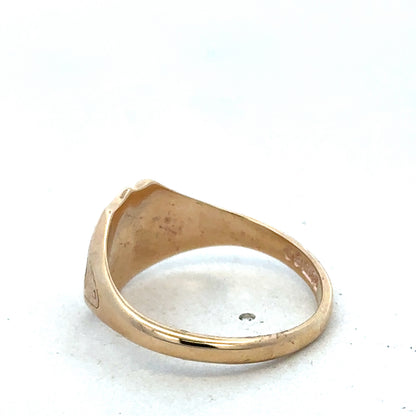 9ct yellow gold signet ring in size T, featuring a smooth polished finish, crafted by Reeves and Sons.