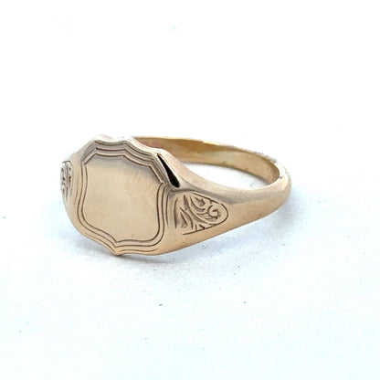 9ct yellow gold signet ring in size T with Reeves and Sons branding, featuring a polished, classic design.