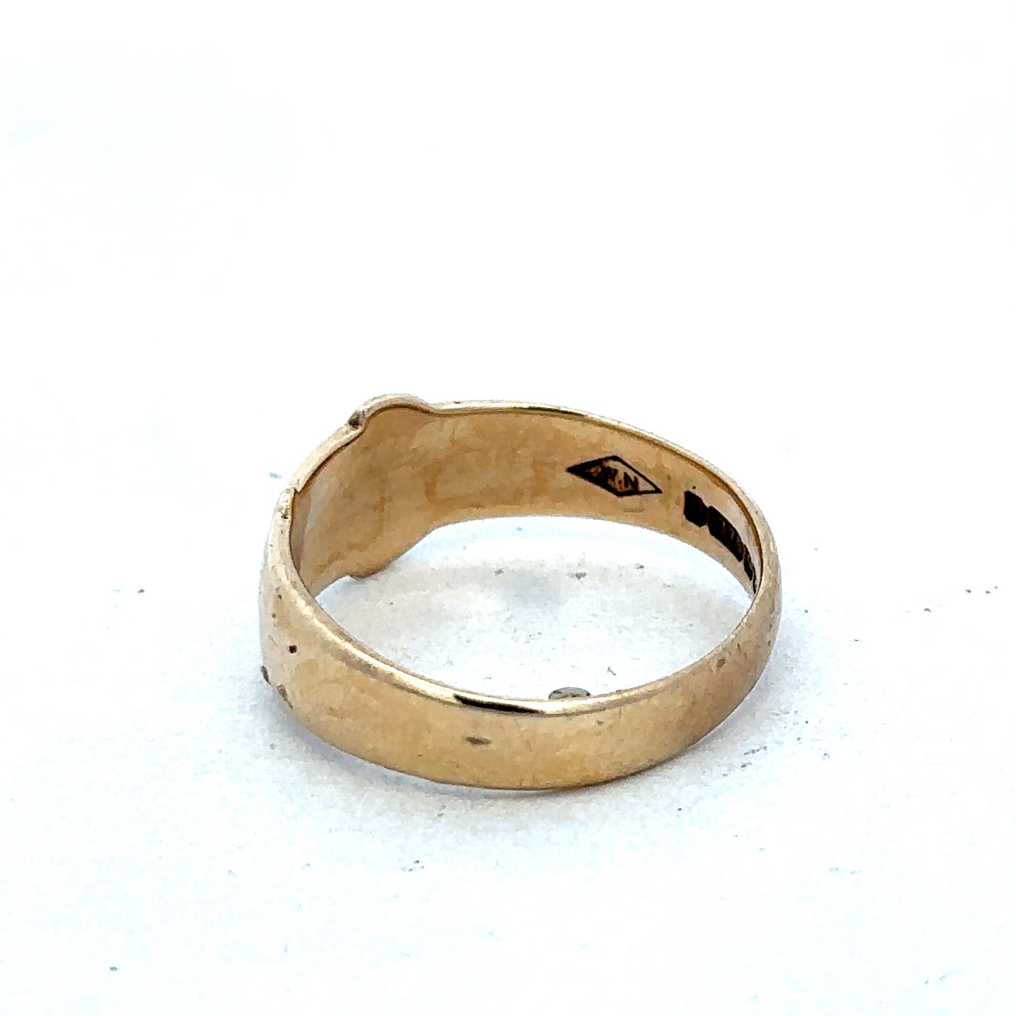 9ct yellow gold buckle ring in size L1/2 with a polished finish, featuring a stylish buckle design by Reeves and Sons.