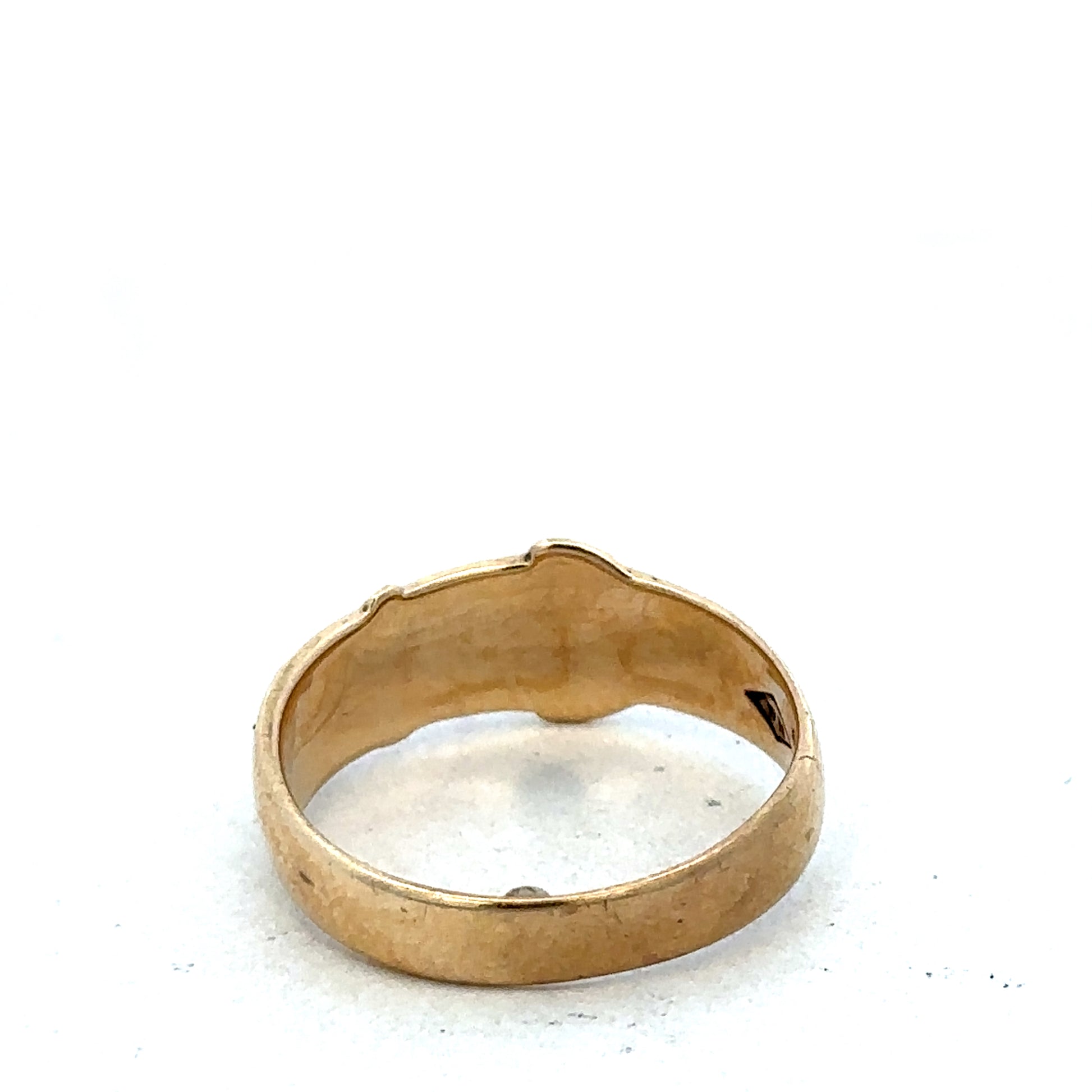 9ct yellow gold buckle ring in size L1/2 with textured design, crafted by Reeves and Sons, shown close-up.