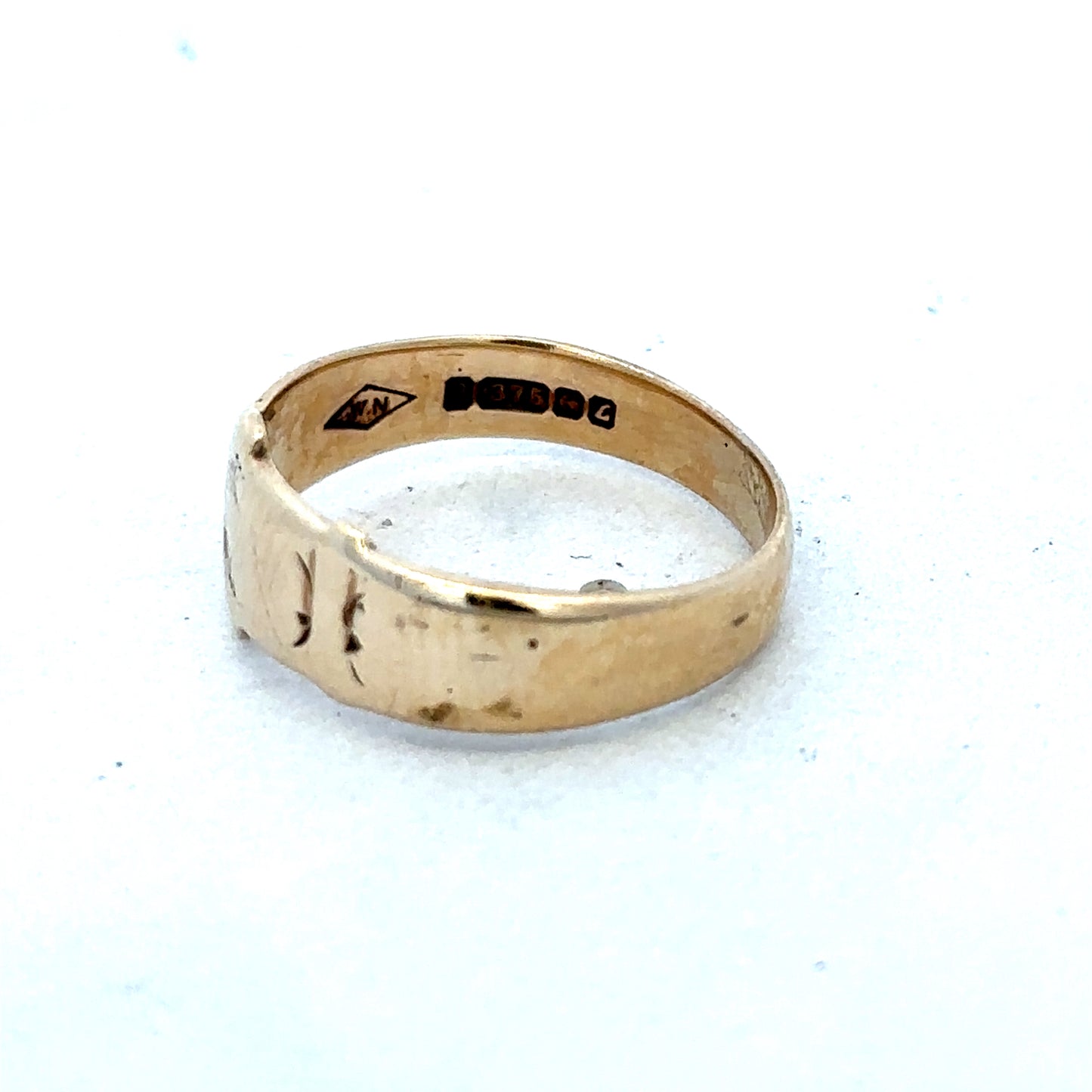 9ct yellow gold buckle ring in size L1/2, Reeves and Sons jewelry, featuring a polished gold buckle design.