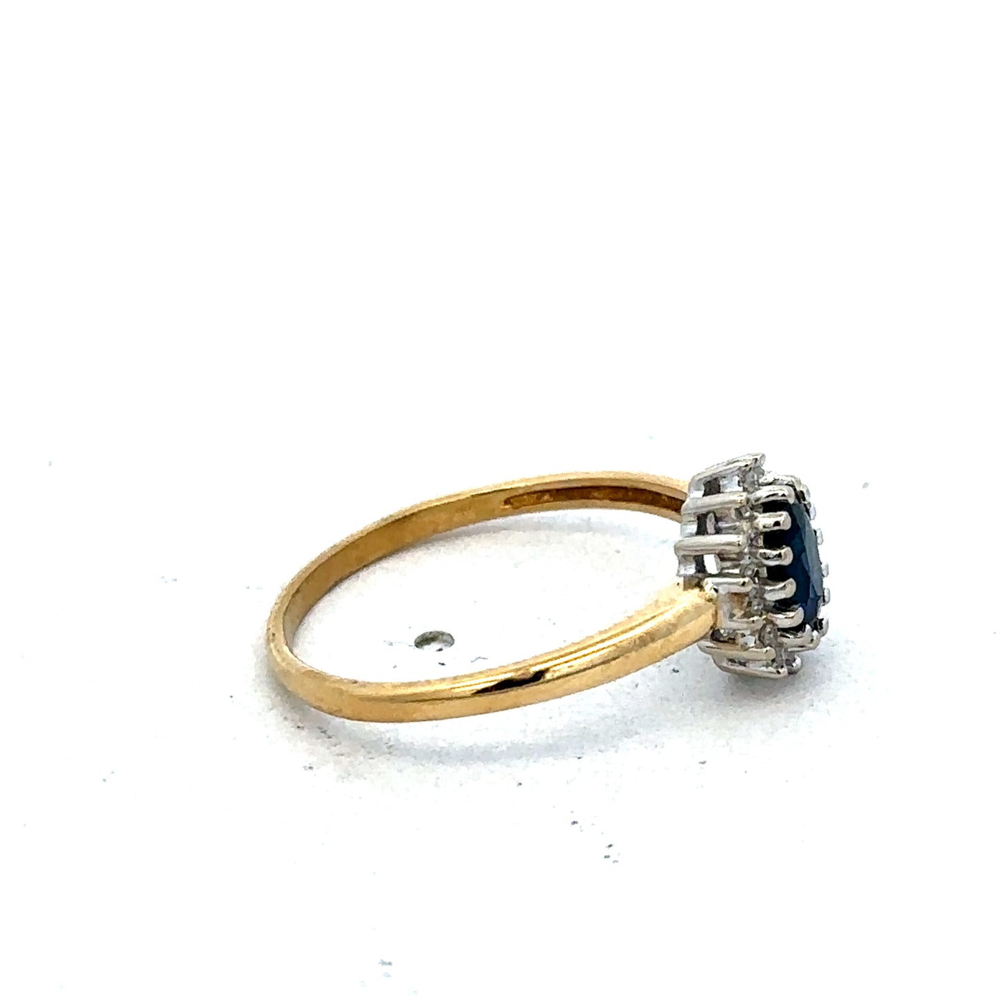 18ct yellow gold sapphire and diamond ring in size L1/2, featuring a detailed Reeves and Sons design and elegant gemstone setting.