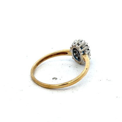 18ct yellow gold sapphire and diamond ring in size L1/2, featuring a central sapphire with diamond accents, by Reeves and Sons.