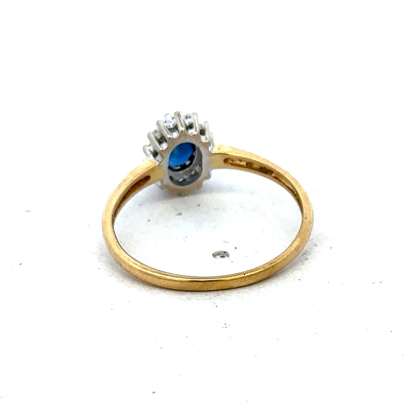 18ct yellow gold sapphire and diamond ring in size L1/2, featuring a detailed Reeves and Sons design.