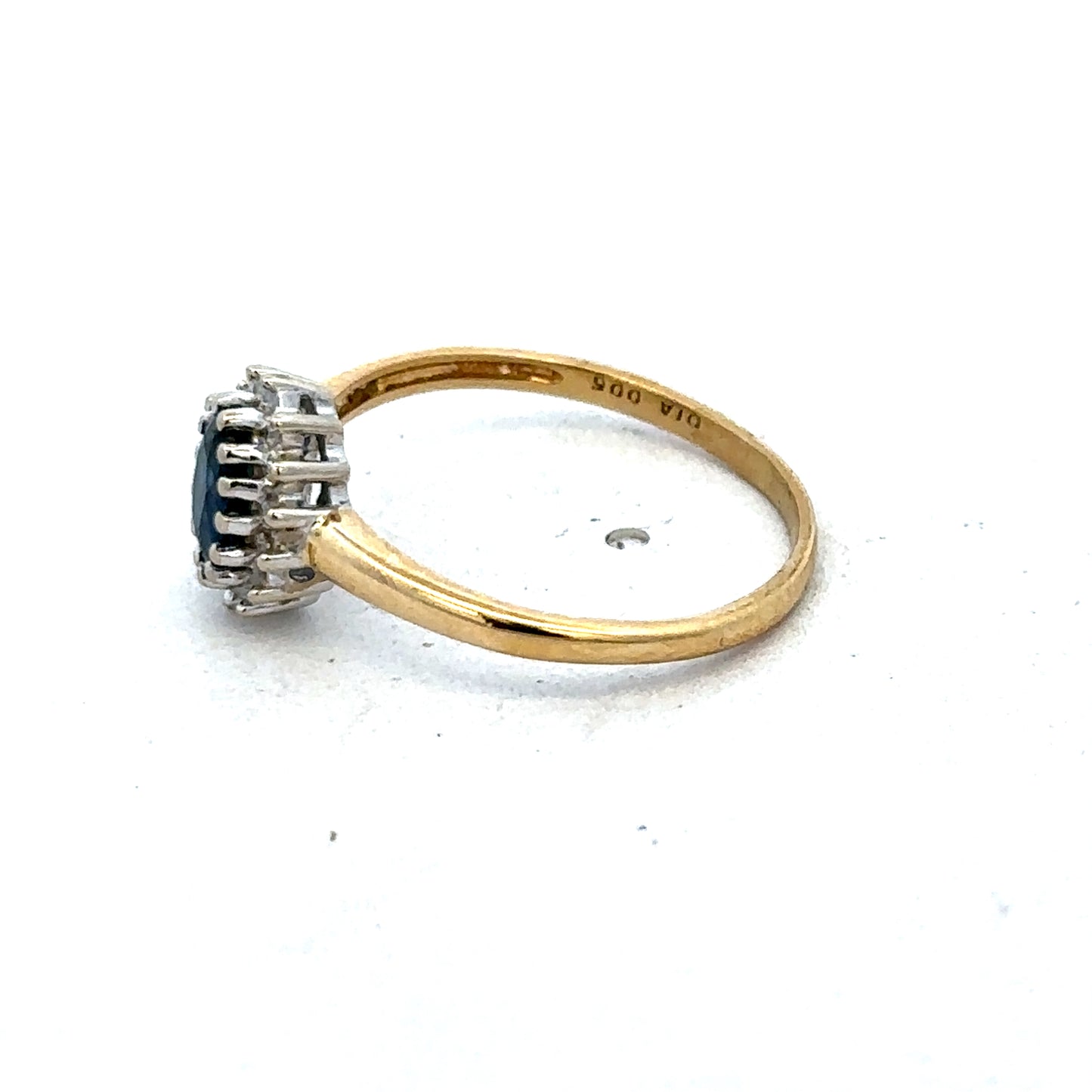 18ct yellow gold sapphire and diamond ring by Reeves and Sons, size L1/2, featuring a central sapphire and sparkling diamonds.