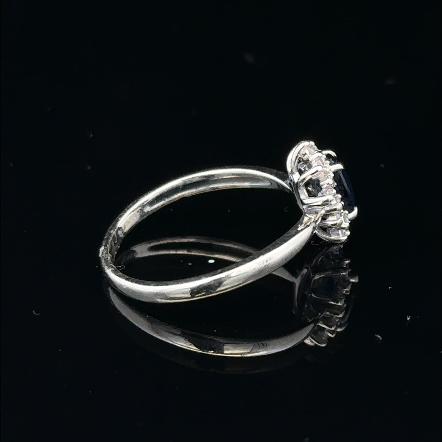 9ct white gold sapphire and diamond ring in size L, featuring a sparkling gemstone design, by Reeves and Sons.