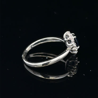 9ct white gold sapphire and diamond ring in size L, featuring a sparkling gemstone design, by Reeves and Sons.