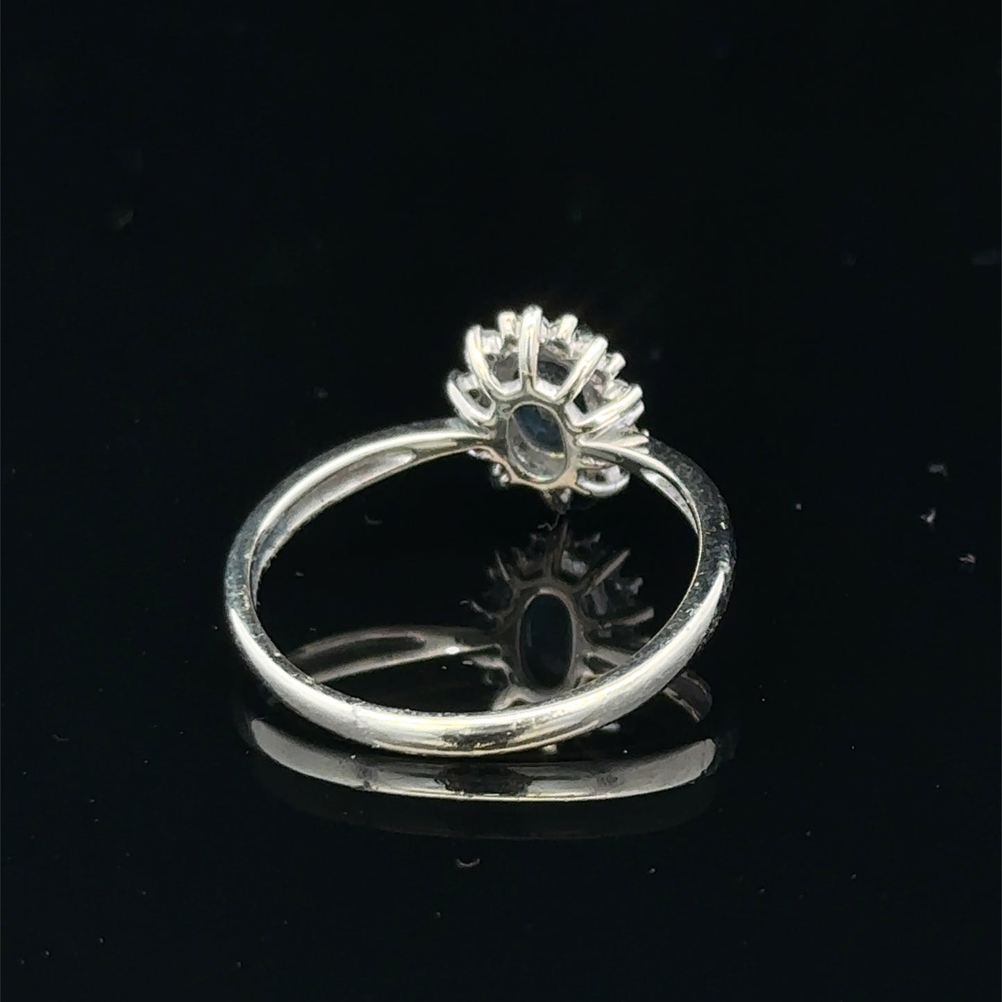 9ct white gold sapphire and diamond ring, size L, featuring a central sapphire with diamond accents, designed by Reeves and Sons.