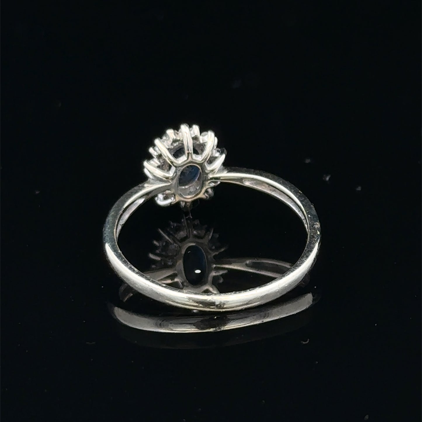 9ct white gold sapphire and diamond ring in size L, featuring a central sapphire gemstone and sparkling diamonds.