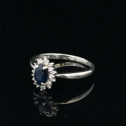 9ct white gold sapphire and diamond ring, size L, featuring a central sapphire with diamond accents, crafted by Reeves and Sons.