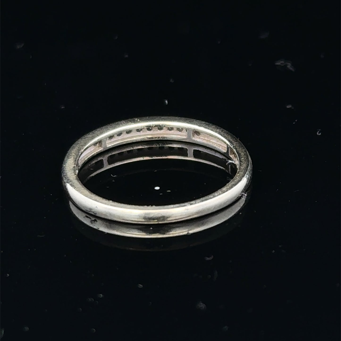 9ct white gold half eternity diamond ring in size N with sparkling diamonds, crafted by Reeves and Sons.