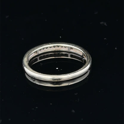 9ct white gold half eternity diamond ring in size N with sparkling diamonds, crafted by Reeves and Sons.