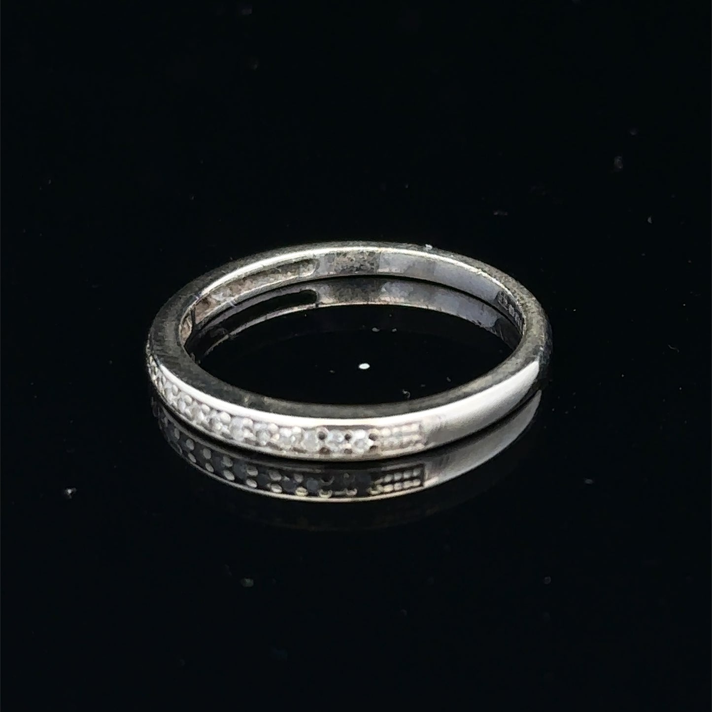 9ct white gold half eternity diamond ring with small sparkling diamonds, size N, by Reeves and Sons.
