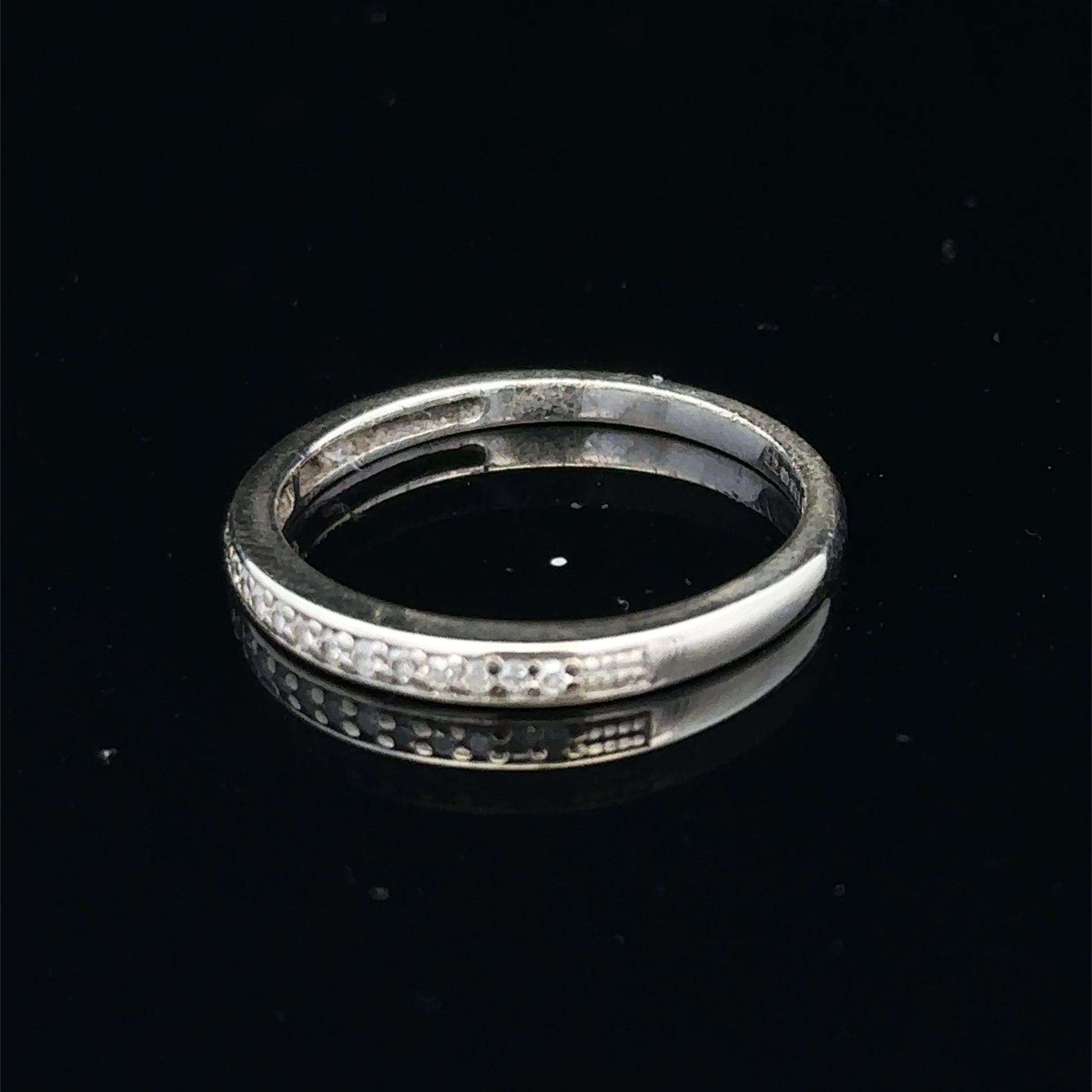 9ct white gold half eternity diamond ring with small sparkling diamonds, size N, by Reeves and Sons.
