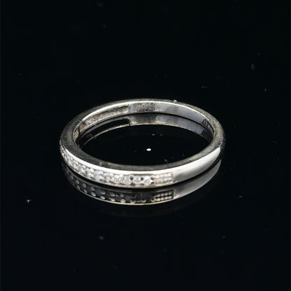 9ct white gold half eternity diamond ring with small sparkling diamonds, size N, by Reeves and Sons.