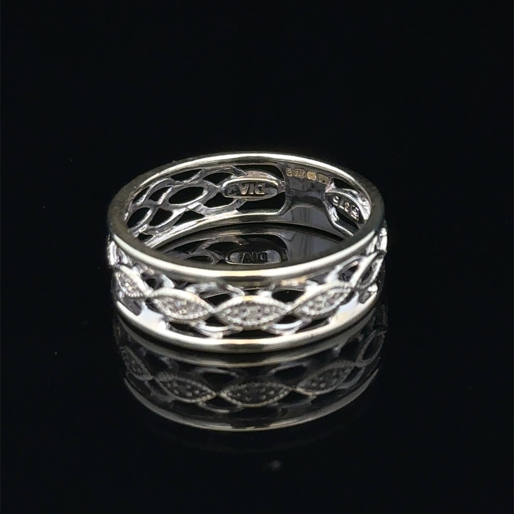 9ct white gold diamond ring in size L with sparkling diamonds, showcasing elegant craftsmanship by Reeves and Sons.