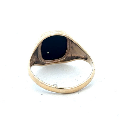 9ct yellow gold signet ring in size T with Reeves and Sons branding, showcasing a polished, classic design.